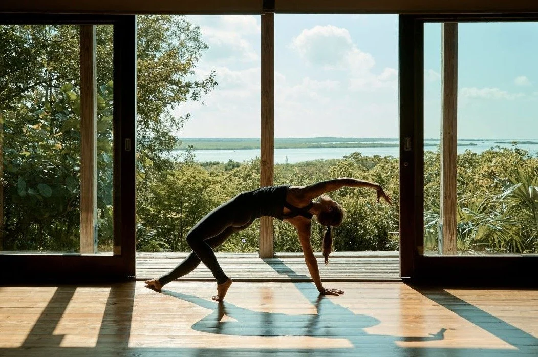 COMO Shambhala yoga class with tropical island views Parrot Cay Turks and Caicos wellness retreat