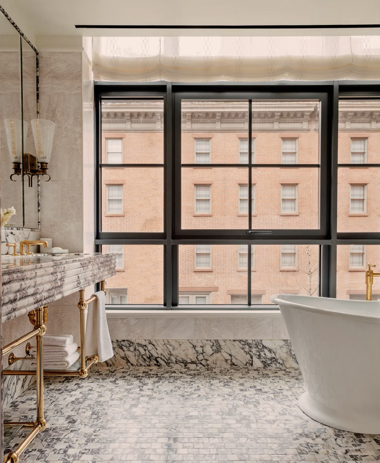 Image of the bathroom with marble floors and casement windows