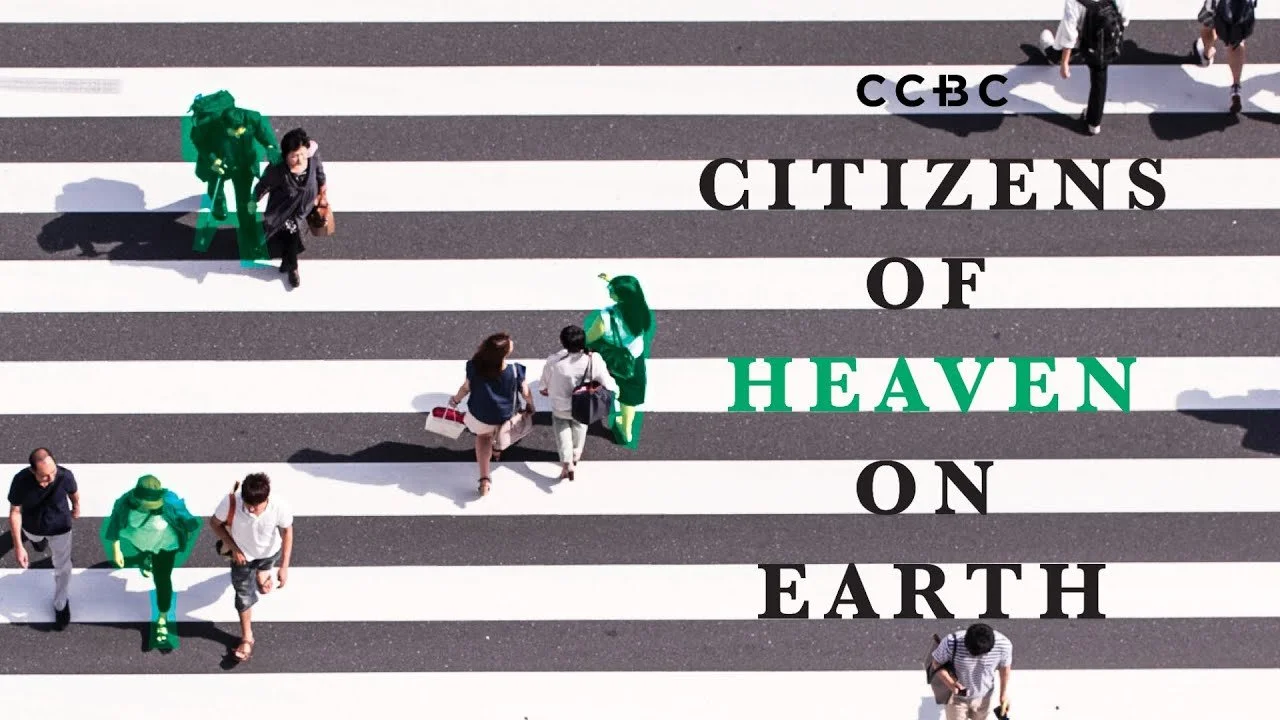 People crossing a crosswalk with text overlay: 'CBC CITIZENS OF HEAVEN ON EARTH'