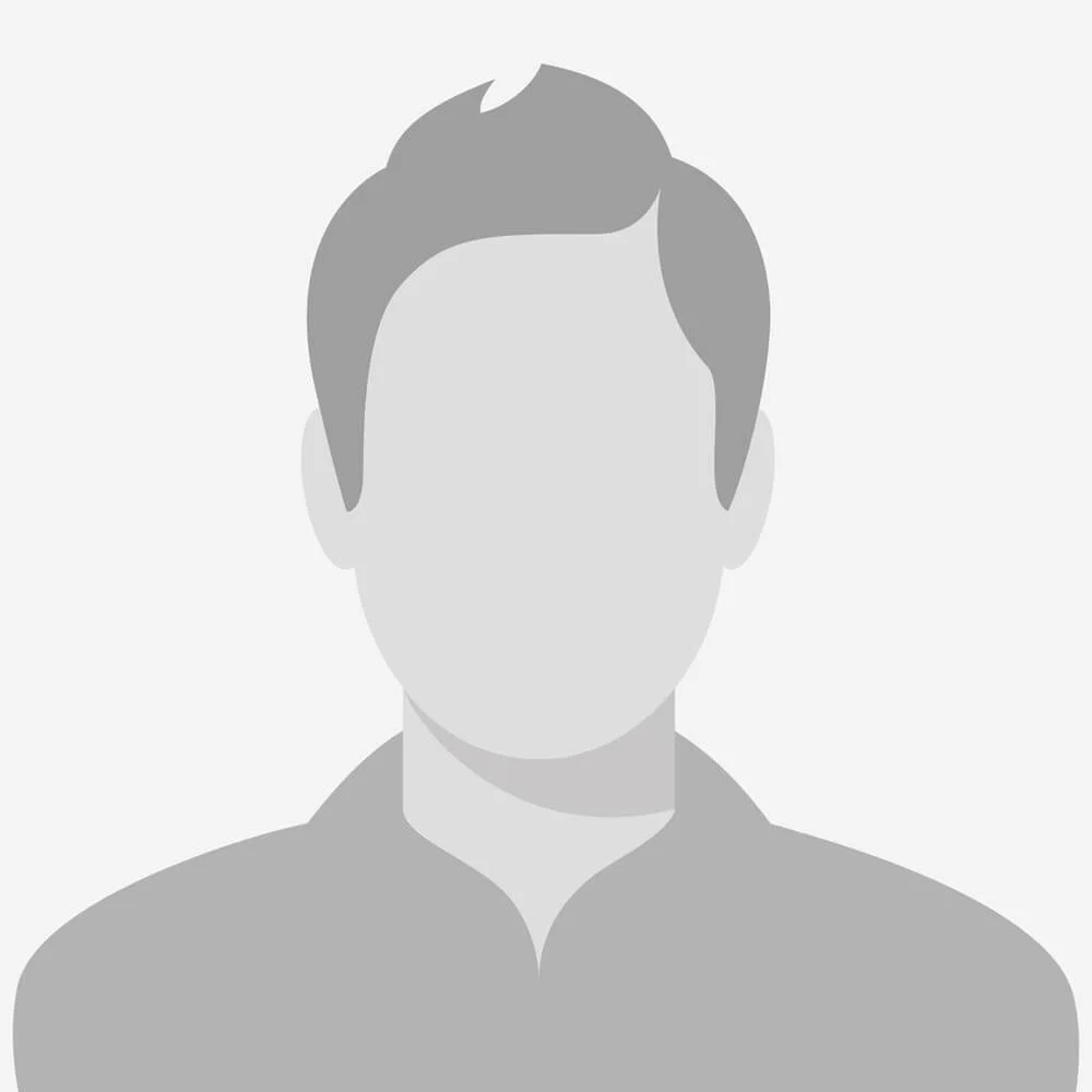 A grayscale, faceless digital illustration of a person with short hair, wearing a collared shirt.