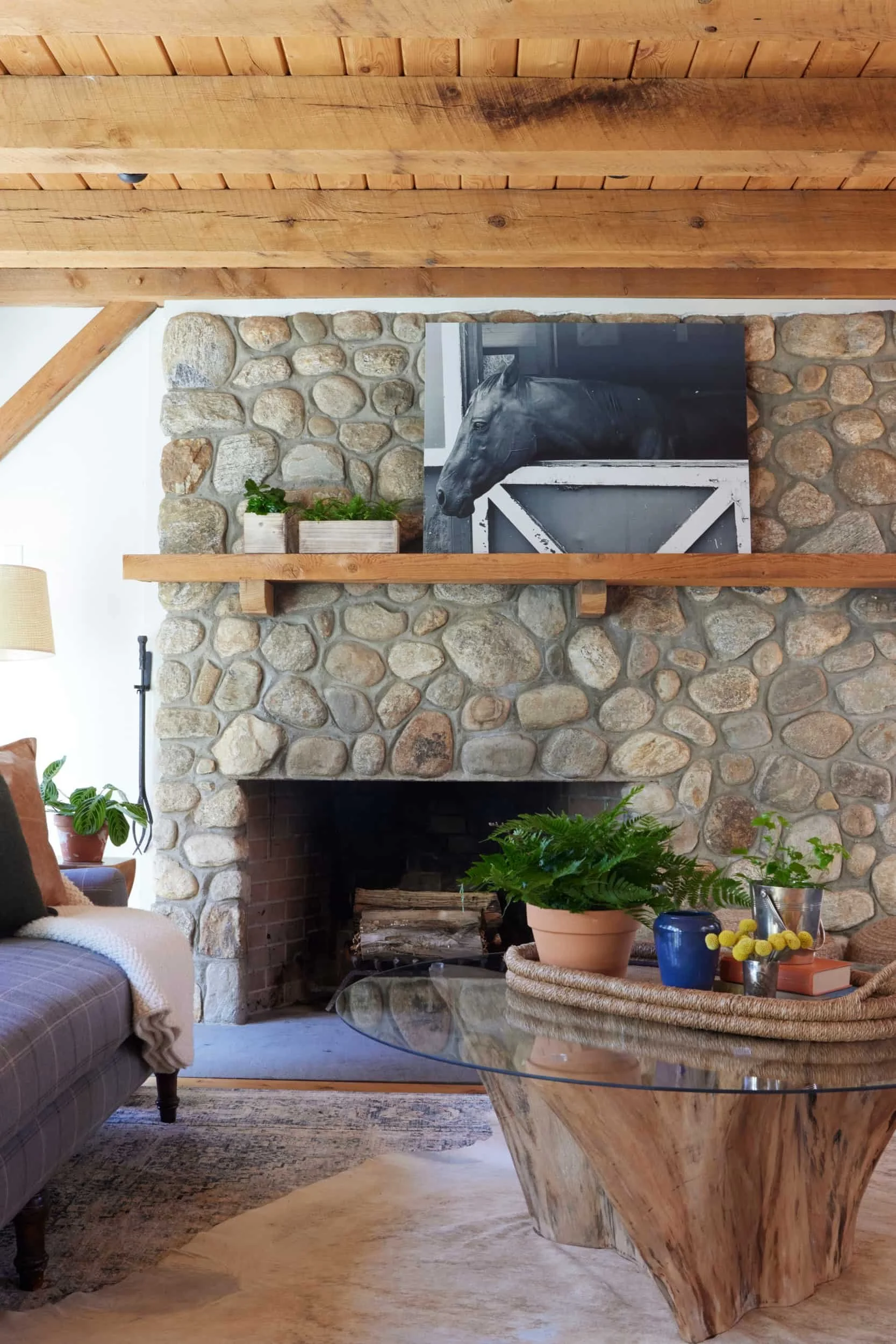 A fireplace at the wilton riding club designed by Westport Connecticut interior designer Caroline Kopp