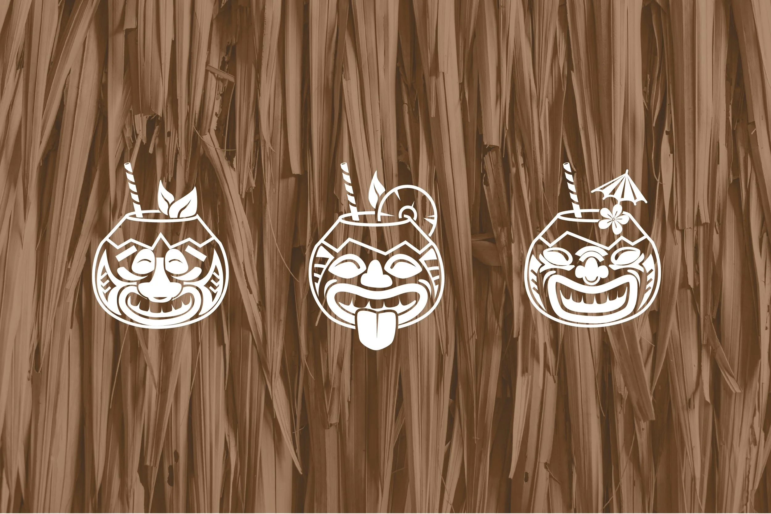 Decorative white coconut carved drawings with straws and accessories, hanging against a textured brown background.