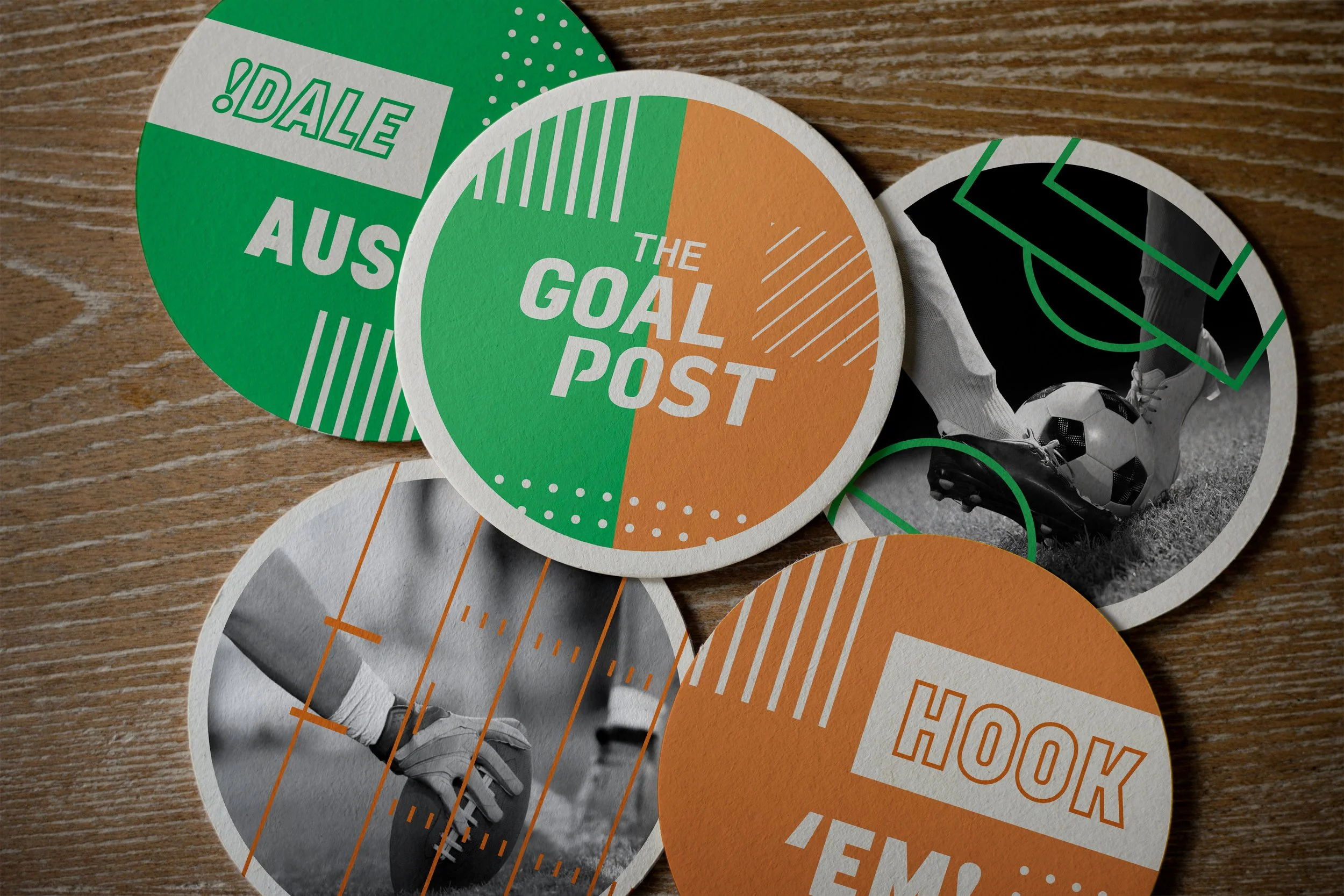 Circular cards with sports and motivational themes, including phrases like 'THE GOAL POST' and 'HOOOK' in green and orange, a black and white photo of a soccer player kicking a ball, and an image of a football player's legs and hand holding a football.