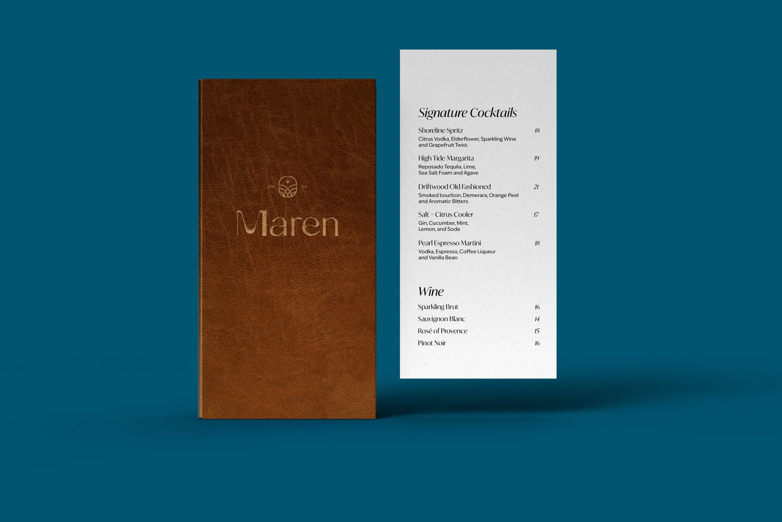 A menu card and a brown leather folder with the text ‘Maren’ embossed on it, set against a blue background.