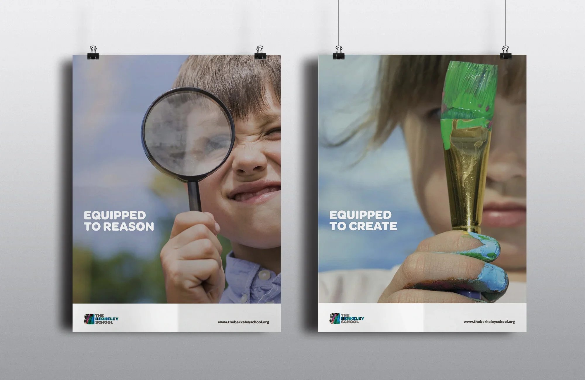 Posters hanging on a wall. The left poster shows a boy smiling with a magnifying glass, with the text "EQUIPPED TO REASON." The right poster shows a girl holding a painted container, with the text "EQUIPPED TO CREATE." Both posters have the logo of The Berkeley School and their website at the bottom.