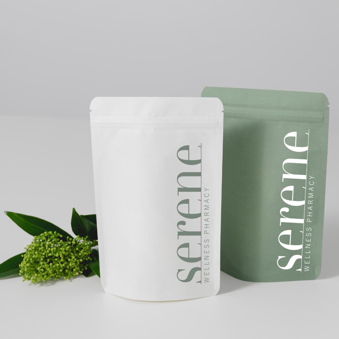 White and green resealable pouches with 'Serene' Wellness Pharmacy branding, a green plant with small flowers beside them.