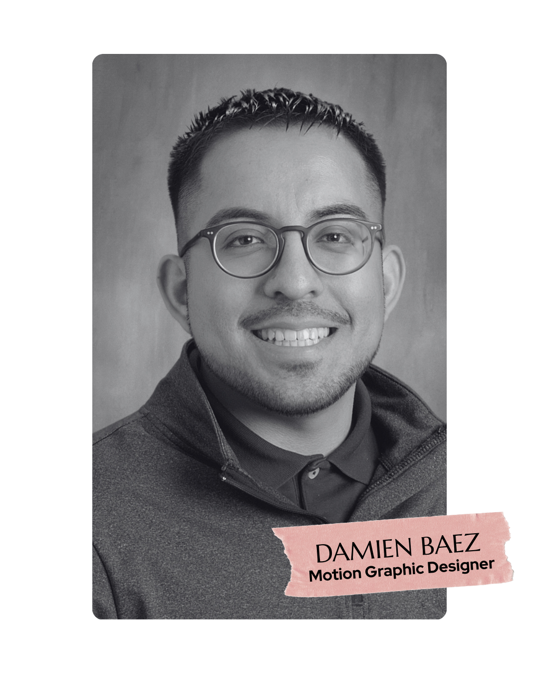 Black and white portrait of a smiling man wearing glasses, a collared shirt, and a zip-up jacket, with a text label reading 'Damien Baez, Motion Graphic Designer' on a pink torn paper graphic.