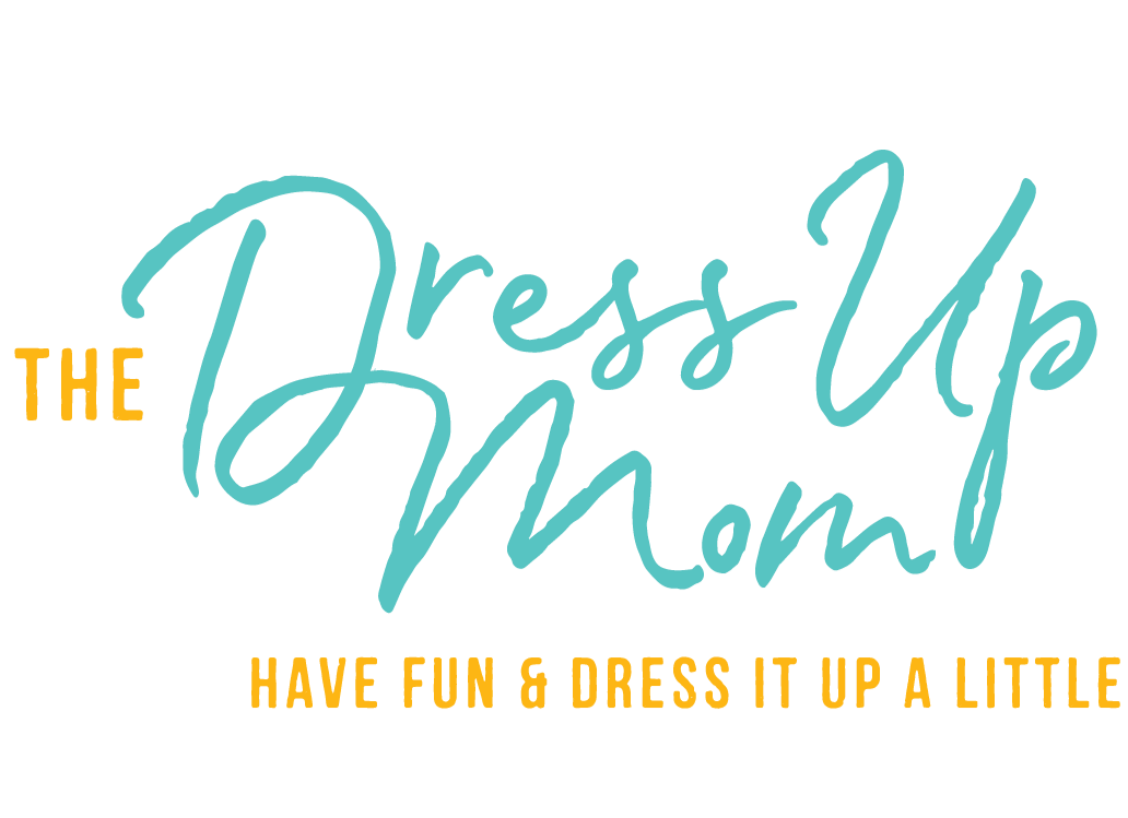 Text-based graphic that says, "The Dress Up Mom! Have fun & dress it up a little" with a black background, teal cursive font, and yellow uppercase font.