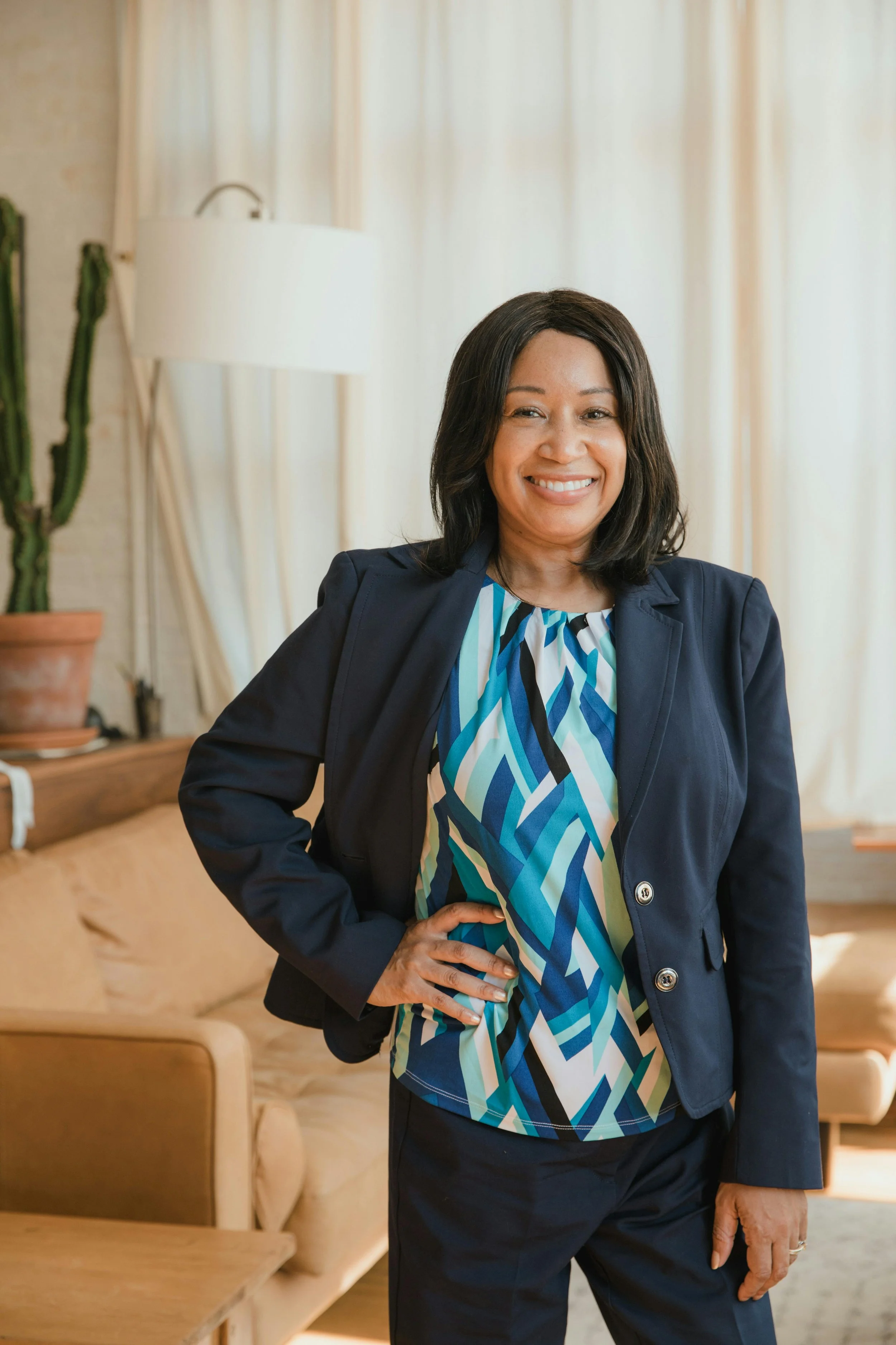 A smiling woman receiving therapy for leaders in Glen Ellyn, IL and Chicago suburbs