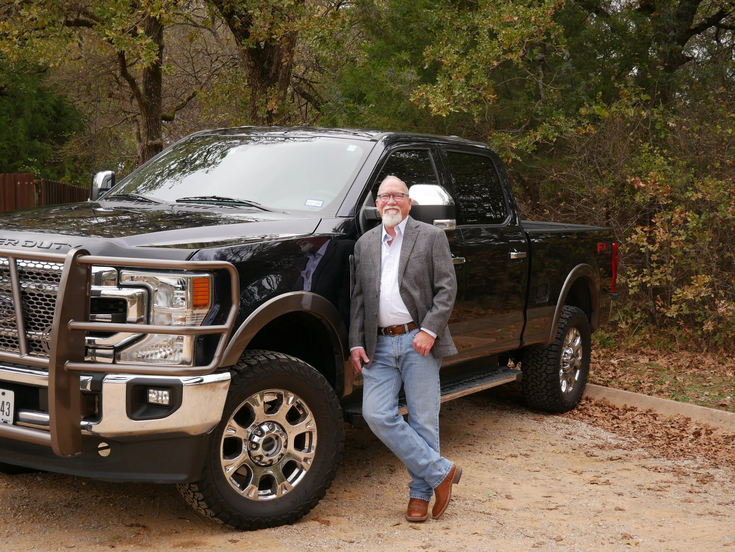 Chris Oldham Standing by his truck.