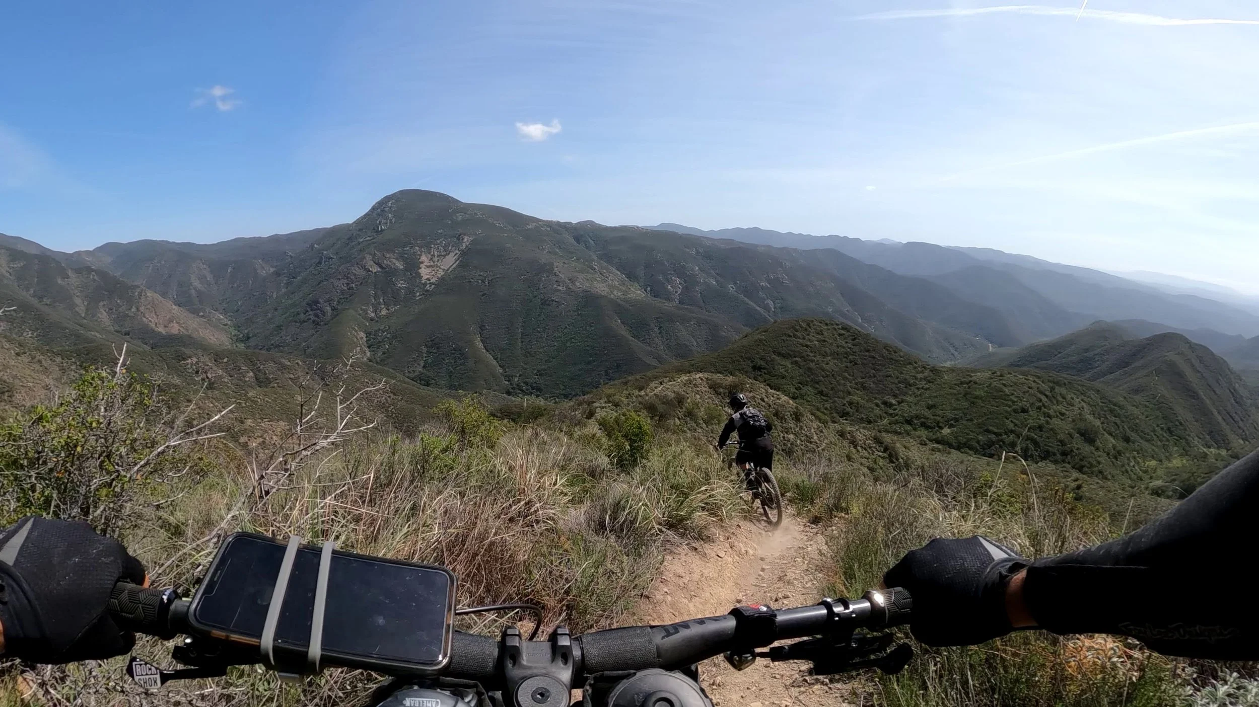 Further down Los Pinos trail, the Sugarloaf sits high above Hot Spring Canyon. The next trail, The San Juan Trail, climbs up towards the peak across the way.