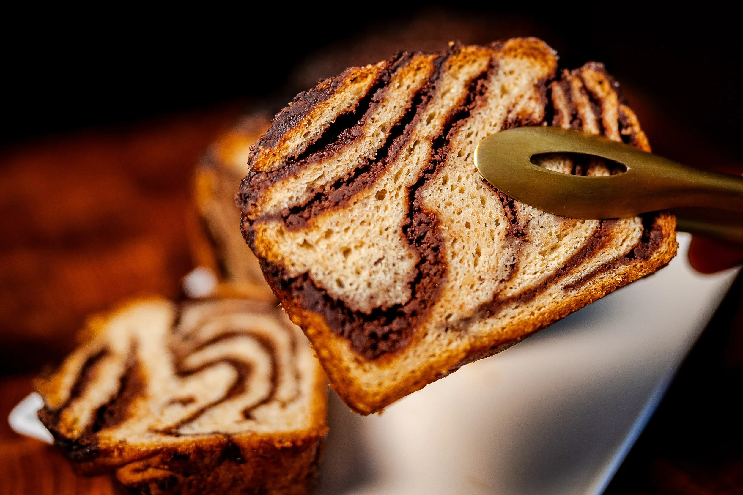 Slice of Chocolate Babka in Tongs.jpg