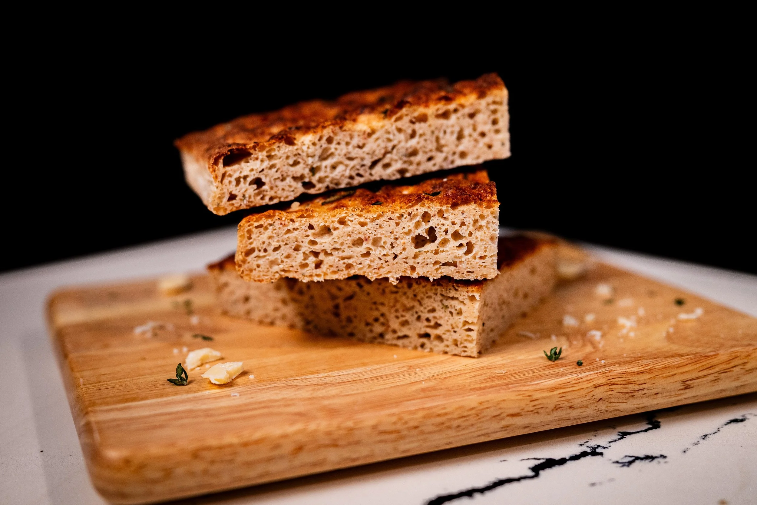 Garlic Herb Parm Focaccia Slices Stacked with Great Crumb Shot.jpg