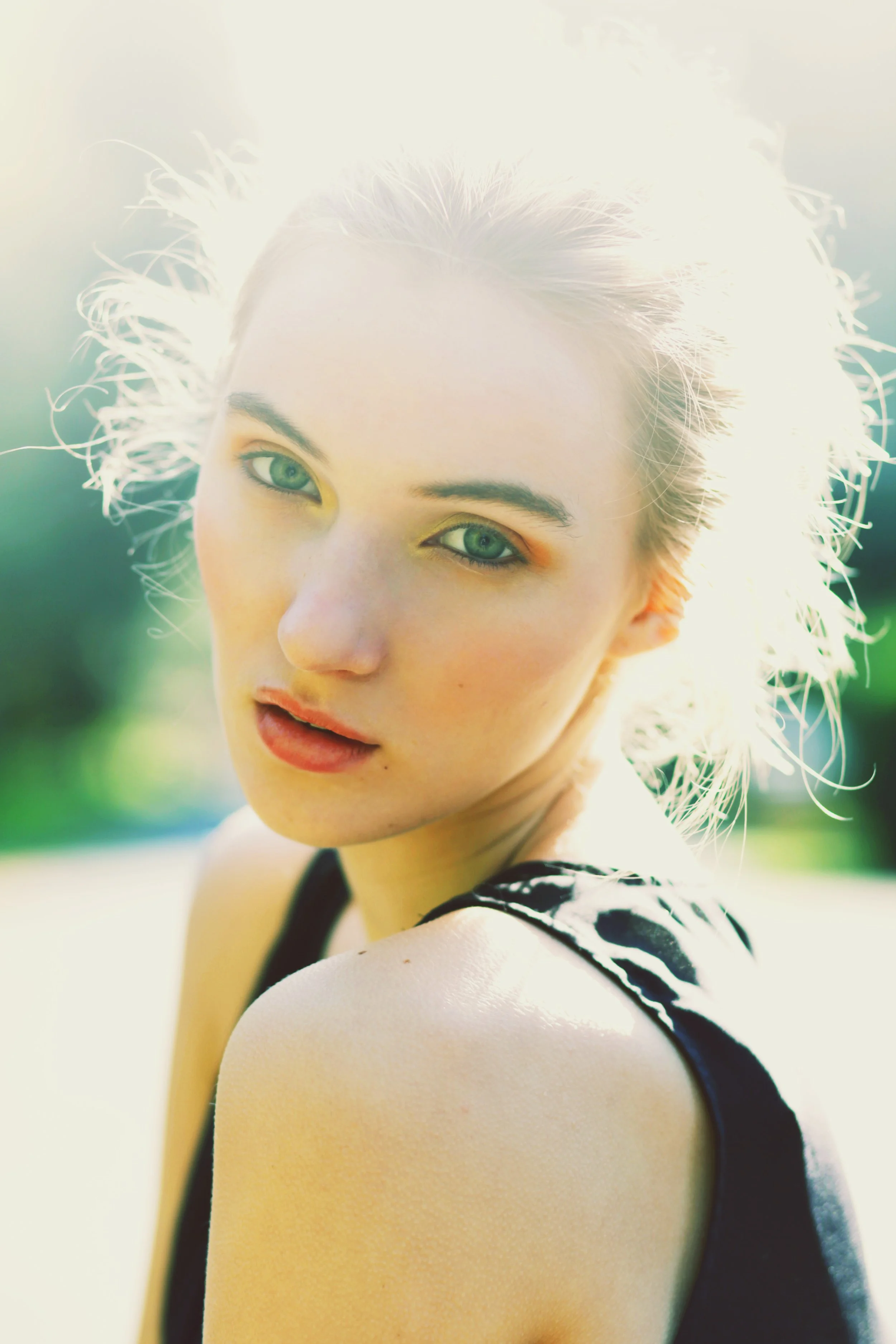 Outdoor fashion portrait of a blonde model with glowing makeup and soft styling, created by Spokane and Coeur d’Alene bridal hair and makeup artist Terri Reece Studios.