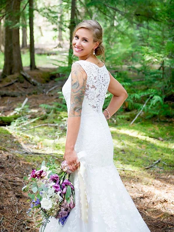 Bride with bouquet standing outside - 
Wedding hair and makeup done by Terri Reece Studios