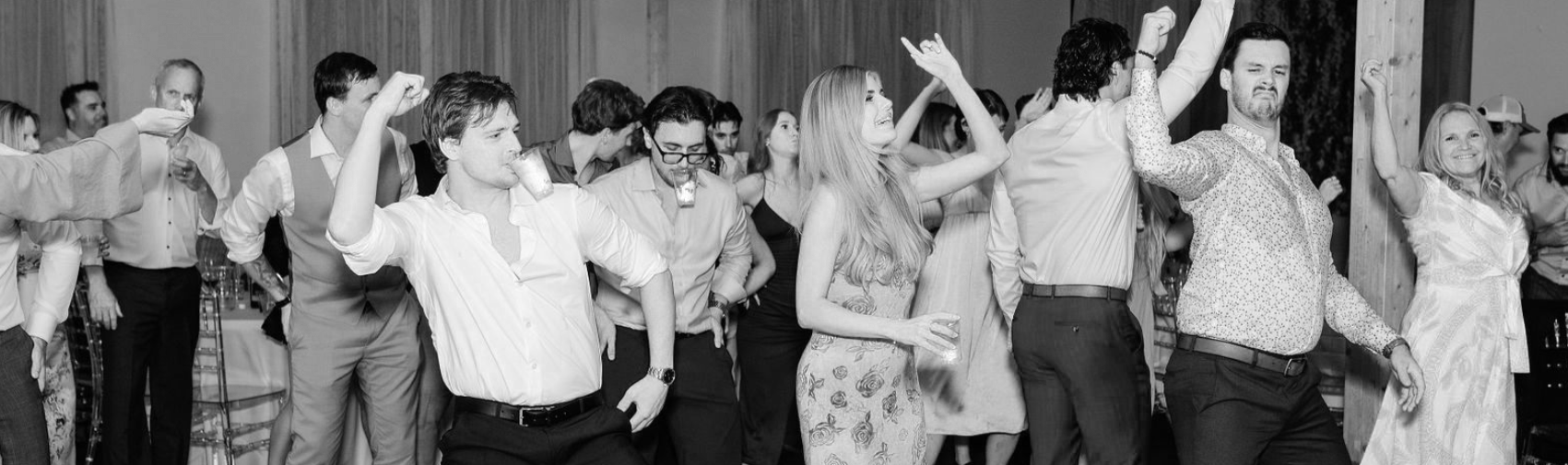People dancing and enjoying themselves at a party or celebration.