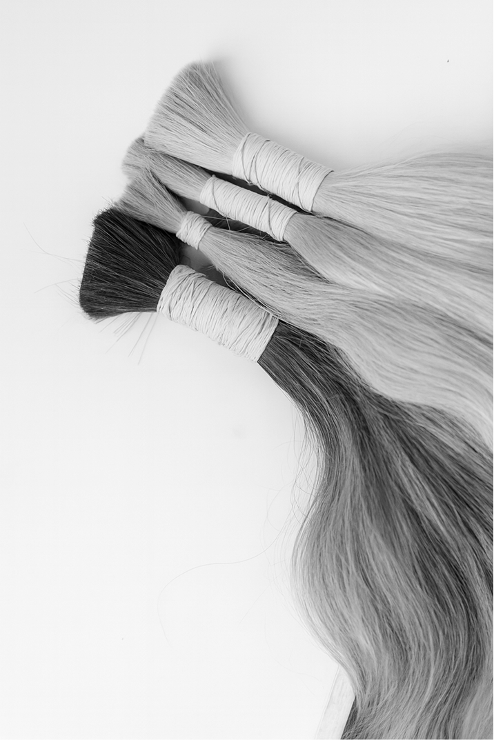 black and white image of hair extension bundles
