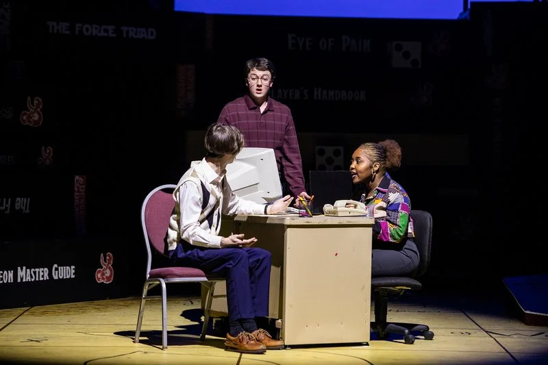 Miles, Steve, and Vera in Vera's office.