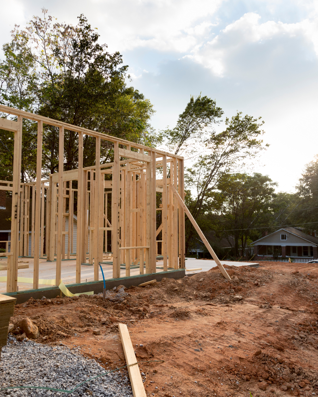 concrete slab with wooden house framework standing