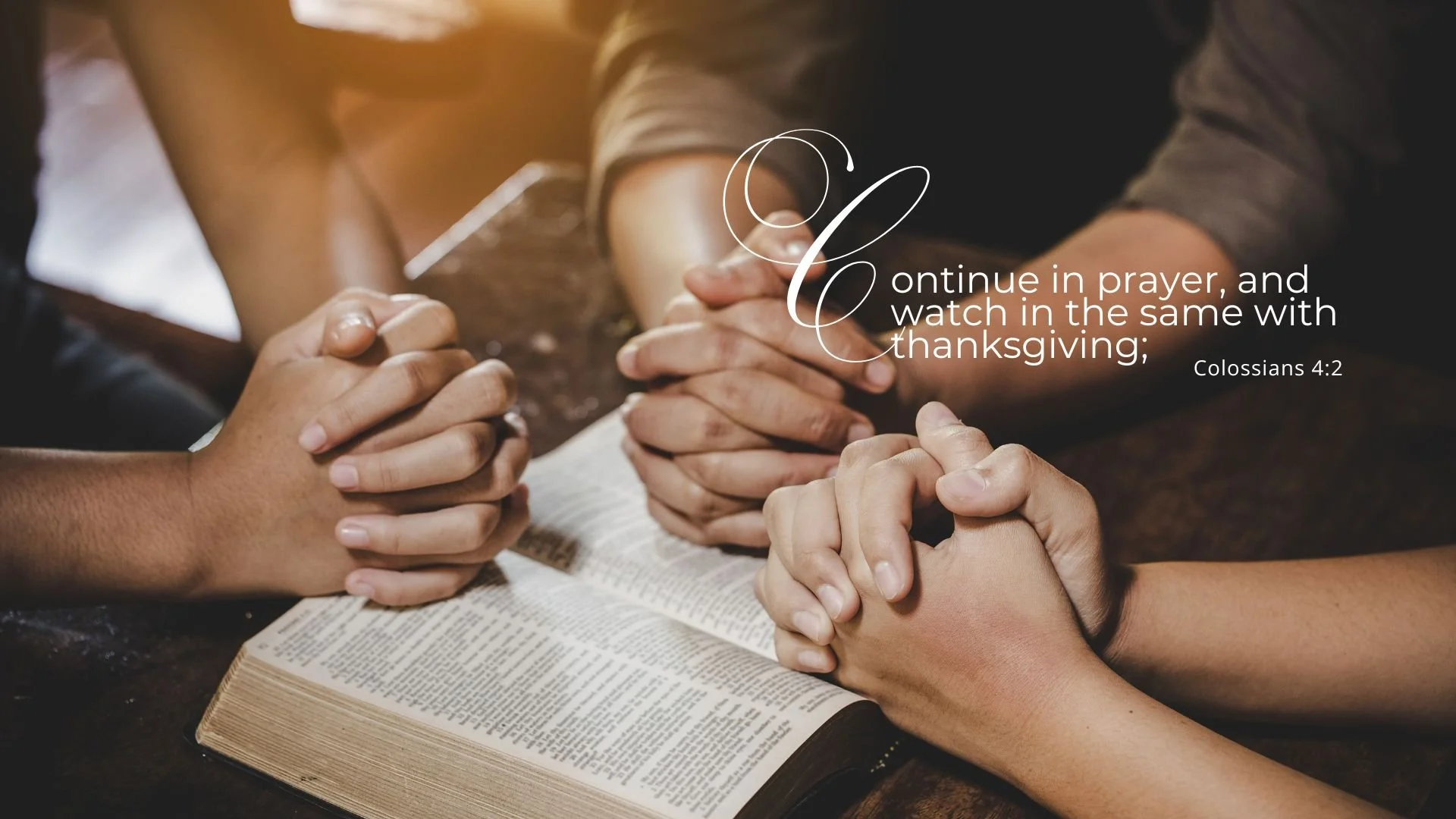 People praying with hands clasped over an open Bible, with a verse from Colossians 4:2 written on the image.