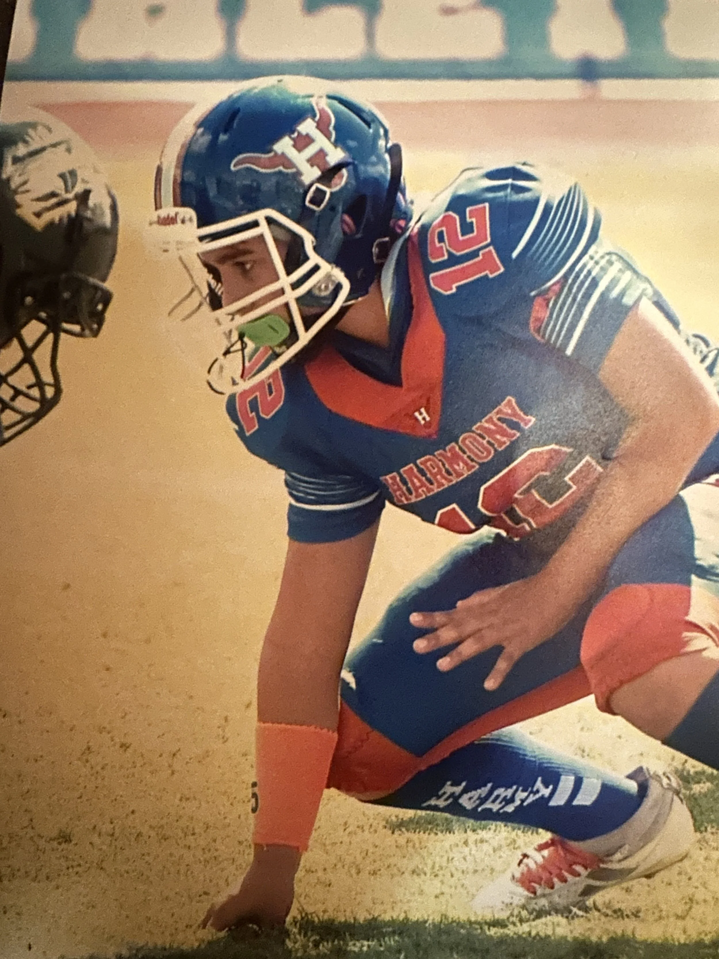 Three children playing soccer, each in a different action pose.