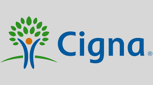 Cigna logo featuring a stylized tree with green leaves and a person-shaped trunk, next to the company name in blue text.