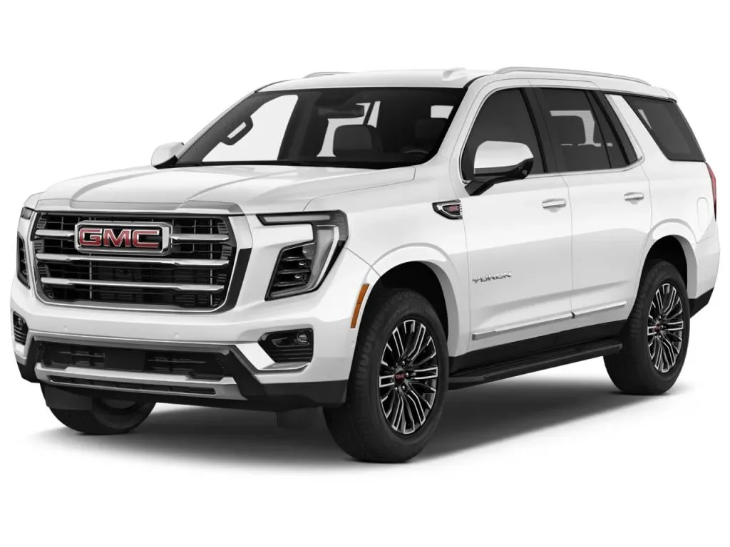 White GMC SUV with black wheels and front grille.