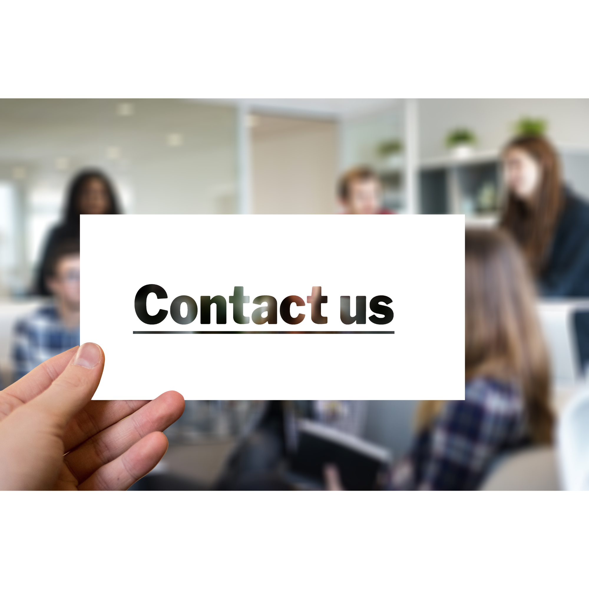 Person holding a white sign with 'Contact us' text in front of a blurred group of people in an office setting.