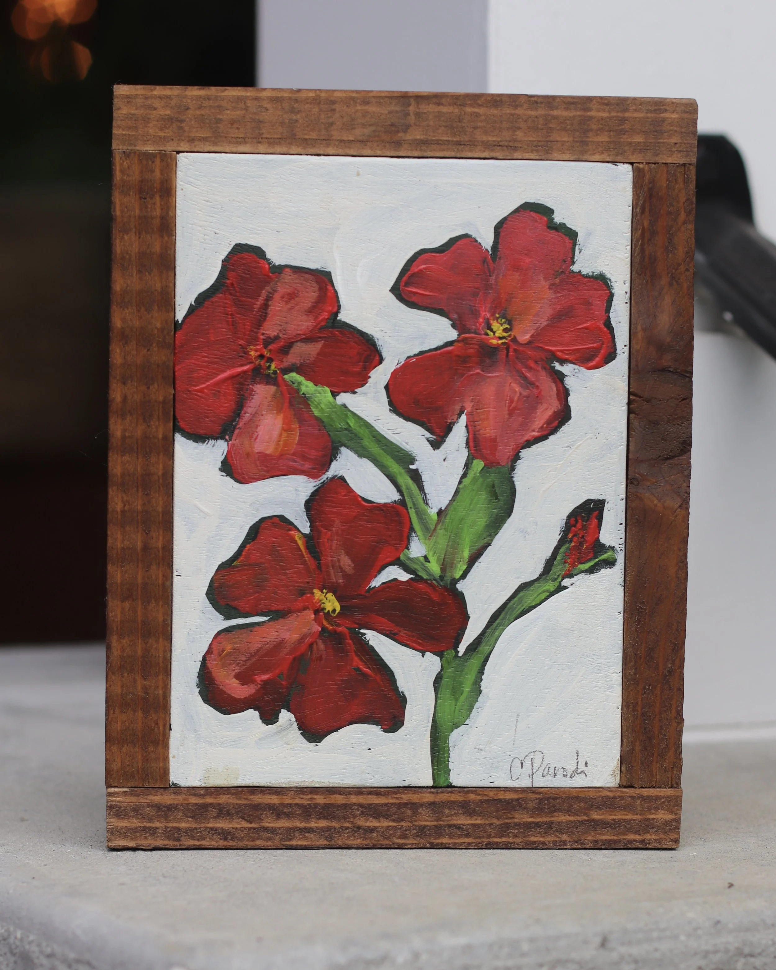 Three Red Flowers and a Bud