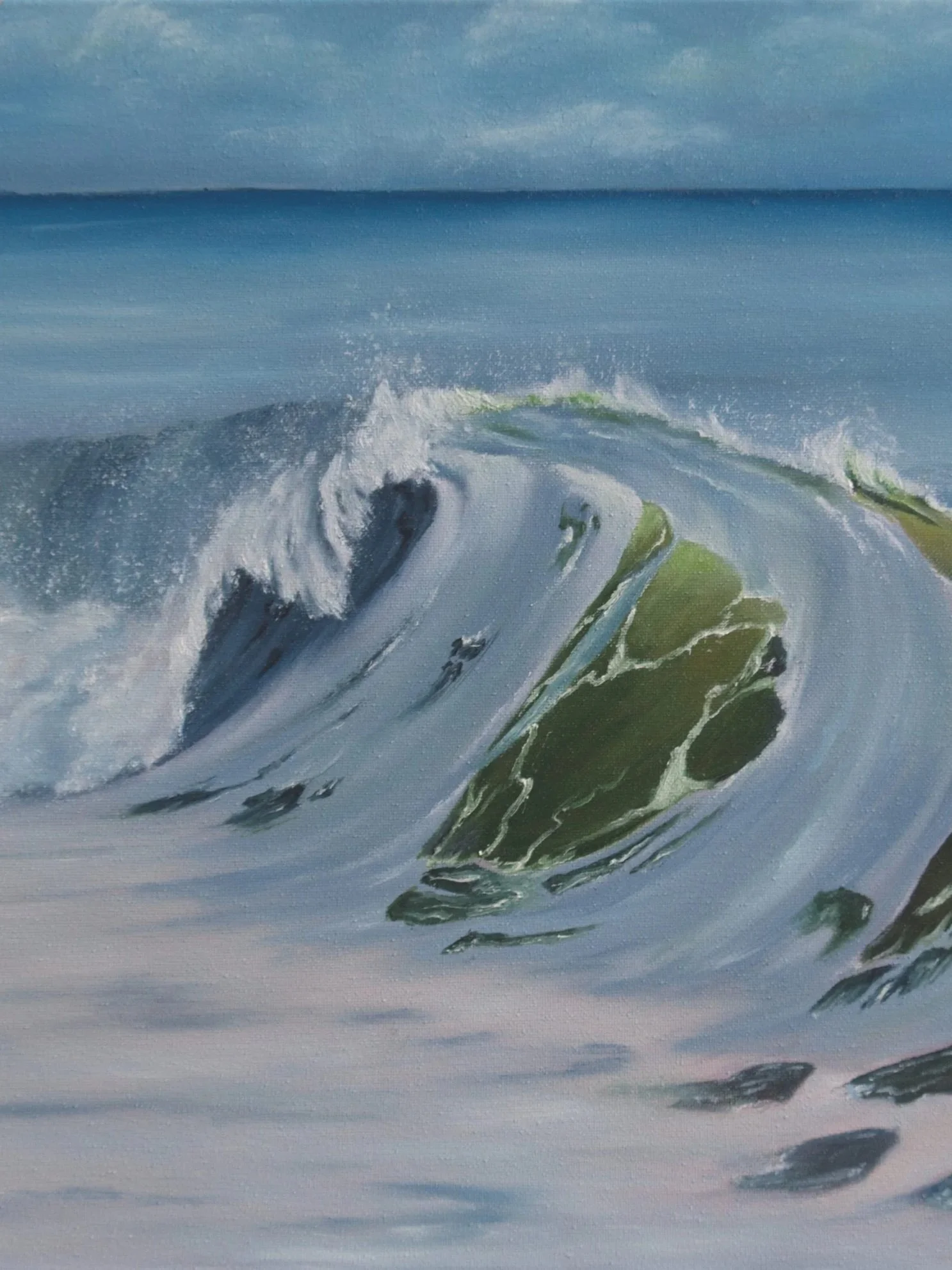 A painting of a large ocean wave crashing with rocks in the foreground and a cloudy sky in the background.