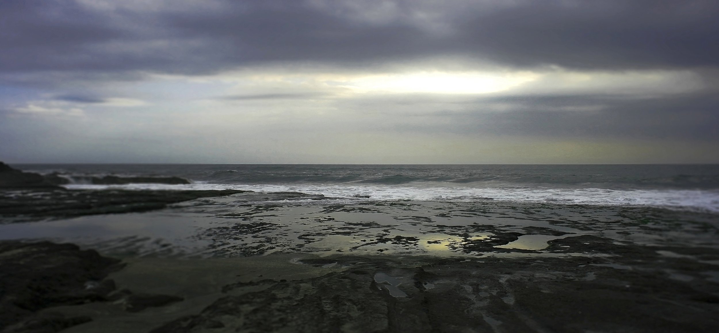 When we see beauty in a sky draped in dark dreary clouds, yet finding an indescribably comforting feeling with a bright glowing sliver of hope - this perhaps is the moment when we have begun to accept death while at the same time finding the courage 