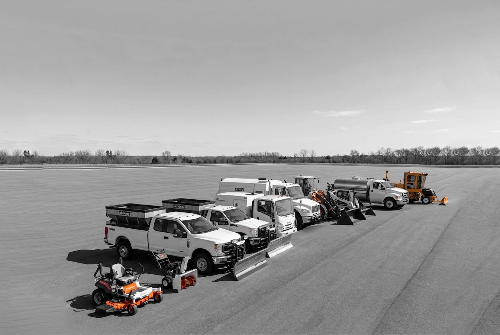 ClearWorks fleet lineup including sweepers, skid steers, loaders, plow trucks, and landscaping equipment.