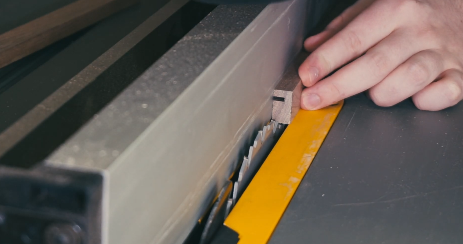 table saw set to cut interior profile of picture frame