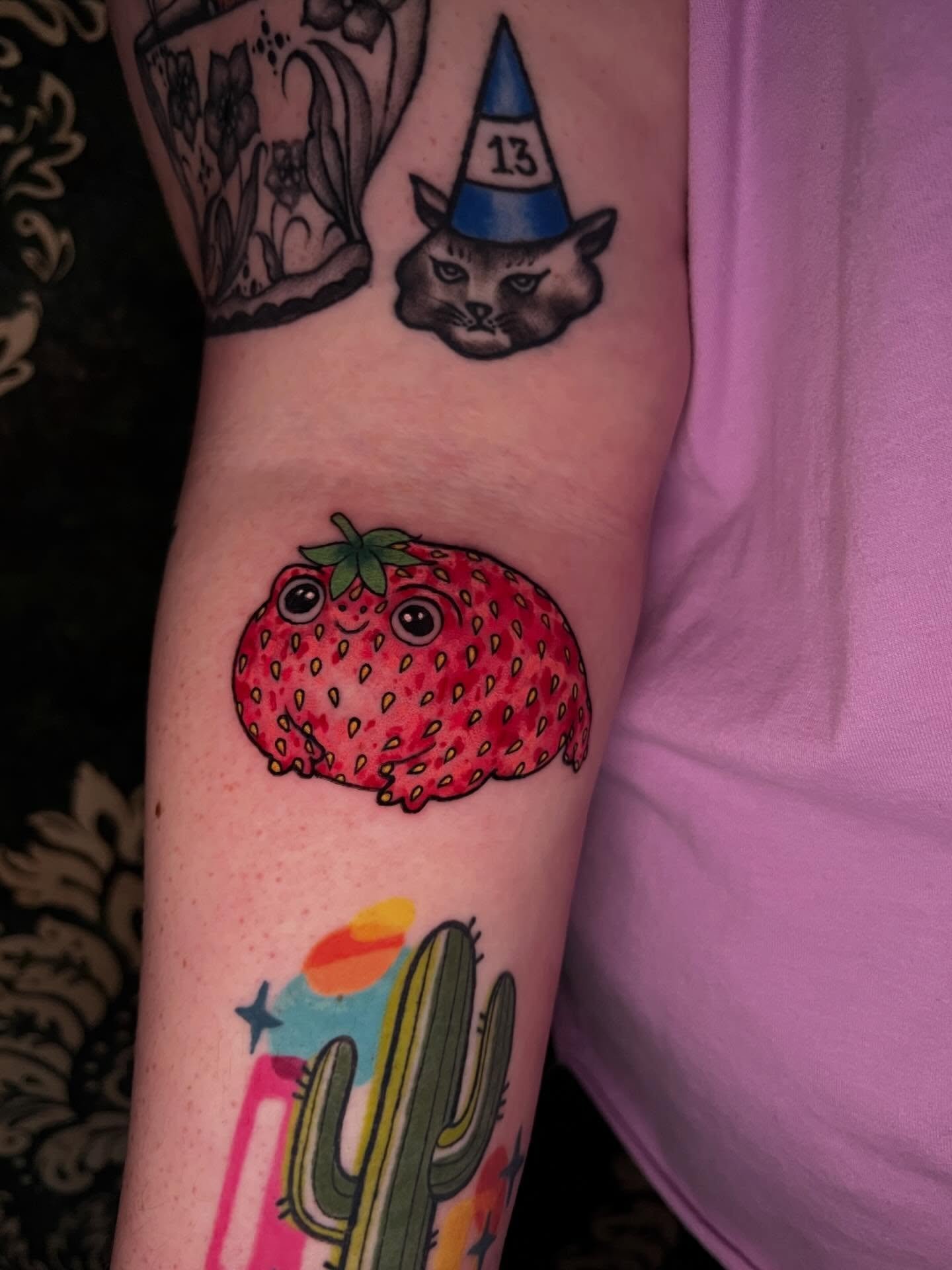 Susie the Strogberry by @griffanthemum 🍓🐸 He is now booking May &amp; June for Trad/Neo Traditional and bold color tattoos. Reach out to him directly through DMs for scheduling or text the shop.