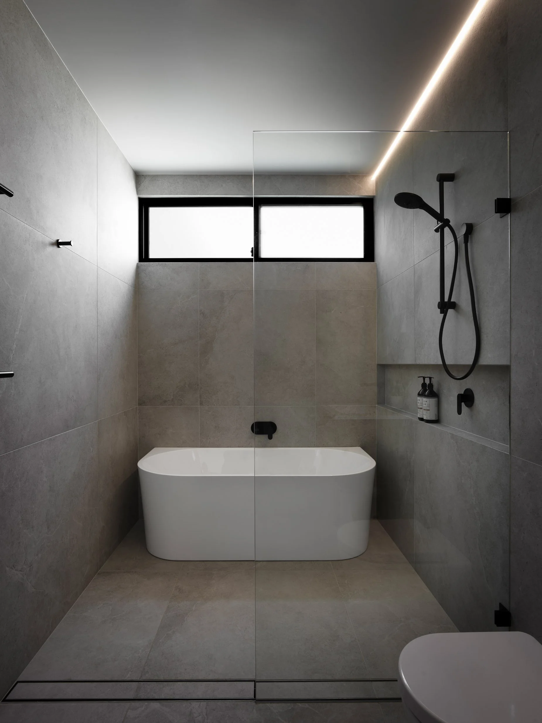 architectural bathroom, shower and bath in wet area behind shower screen, shower neiche