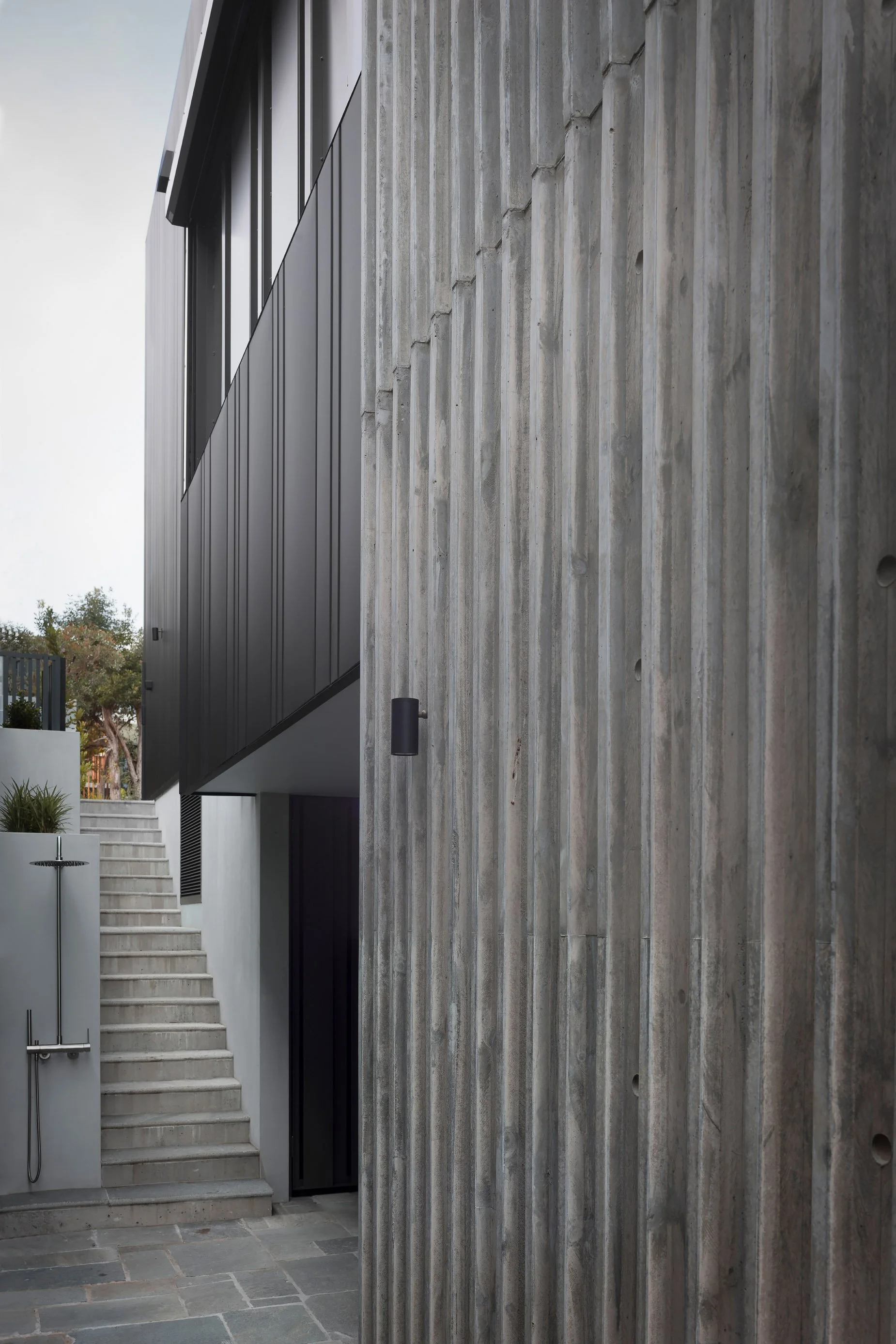 Killcare, Off-form ribbed concrete house, colour bond cassette wall cladding