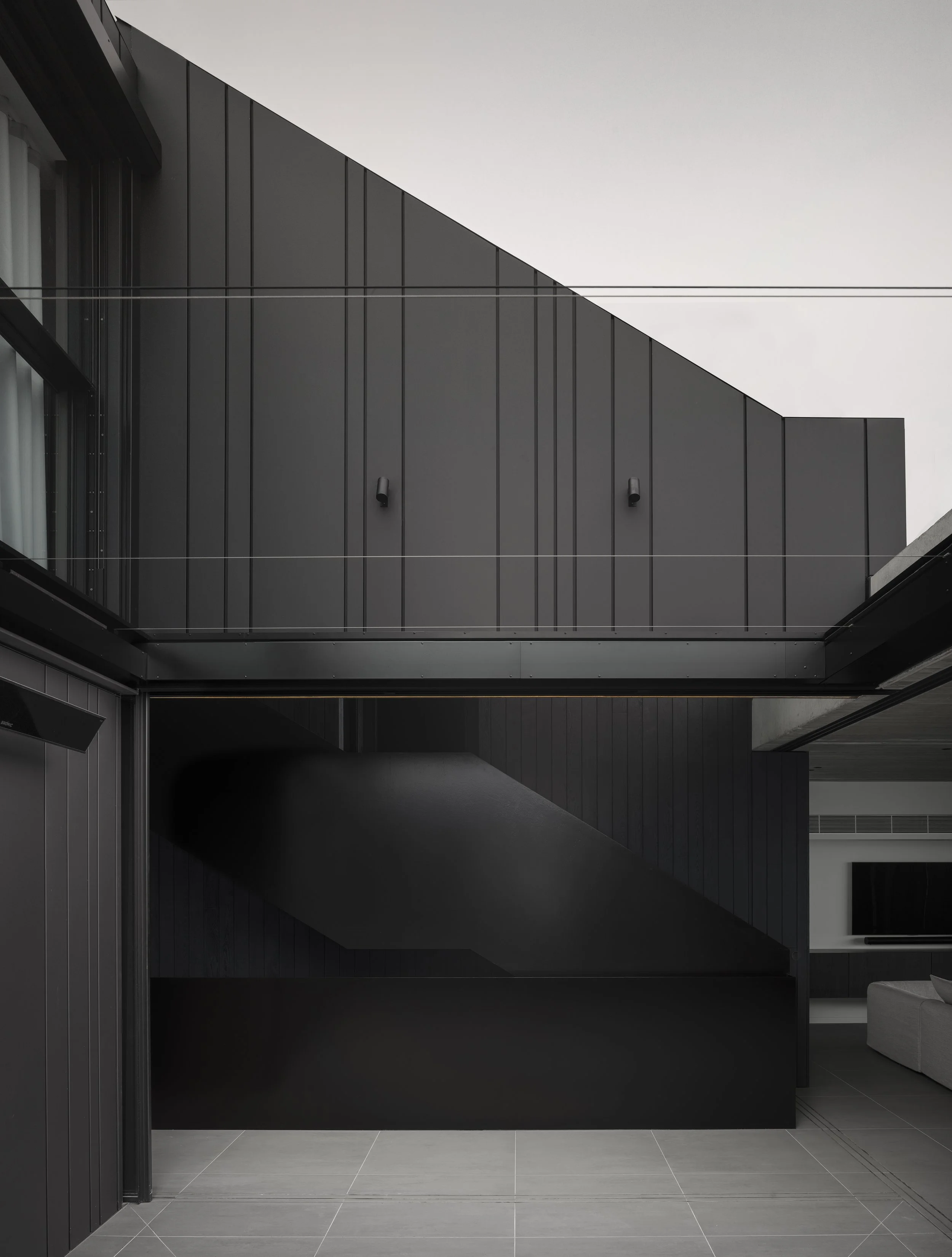 Black metal cladding, courtyard, vitrocsa doors central coast