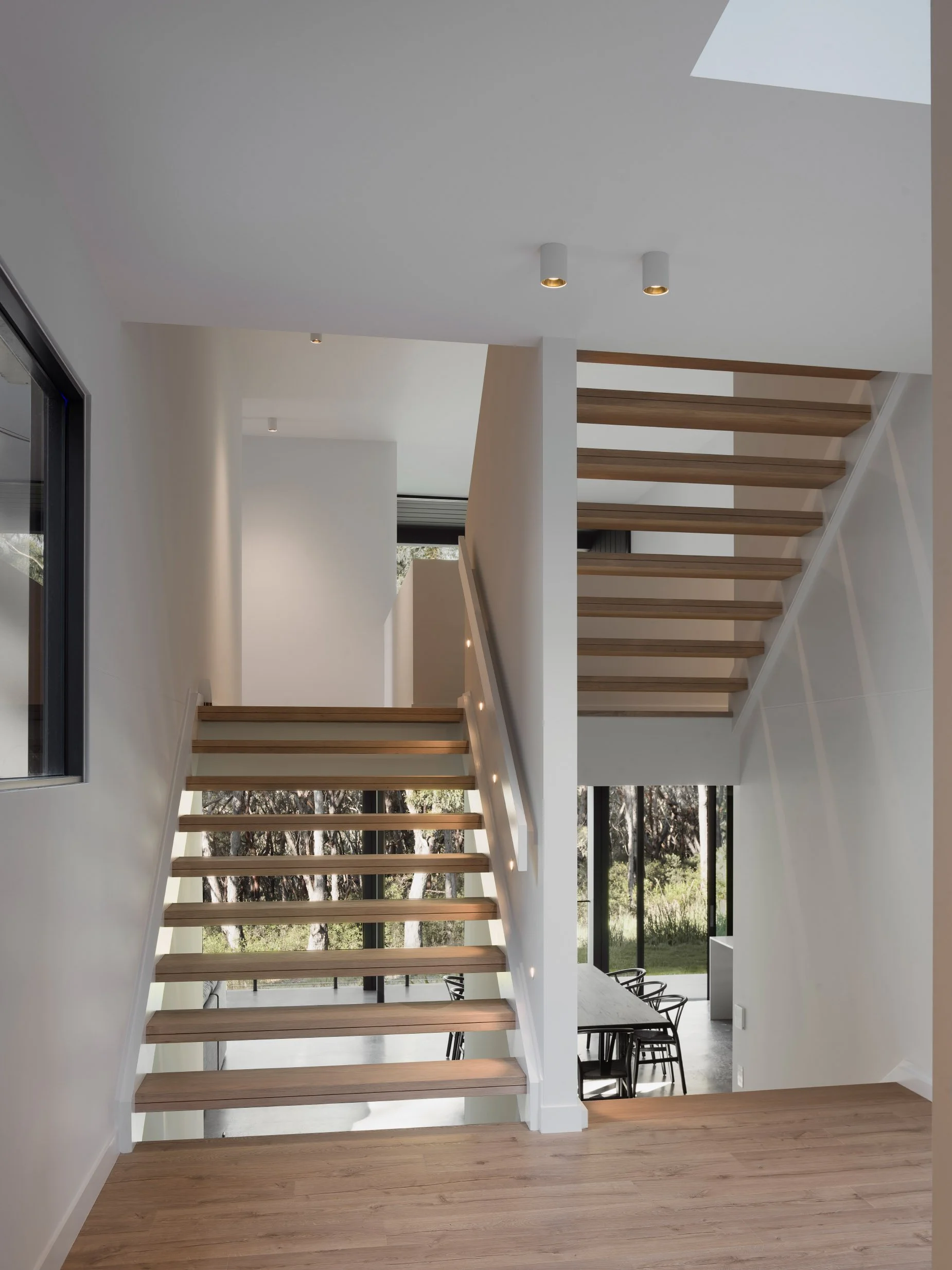 oak stairs, split staircase, stair lighting