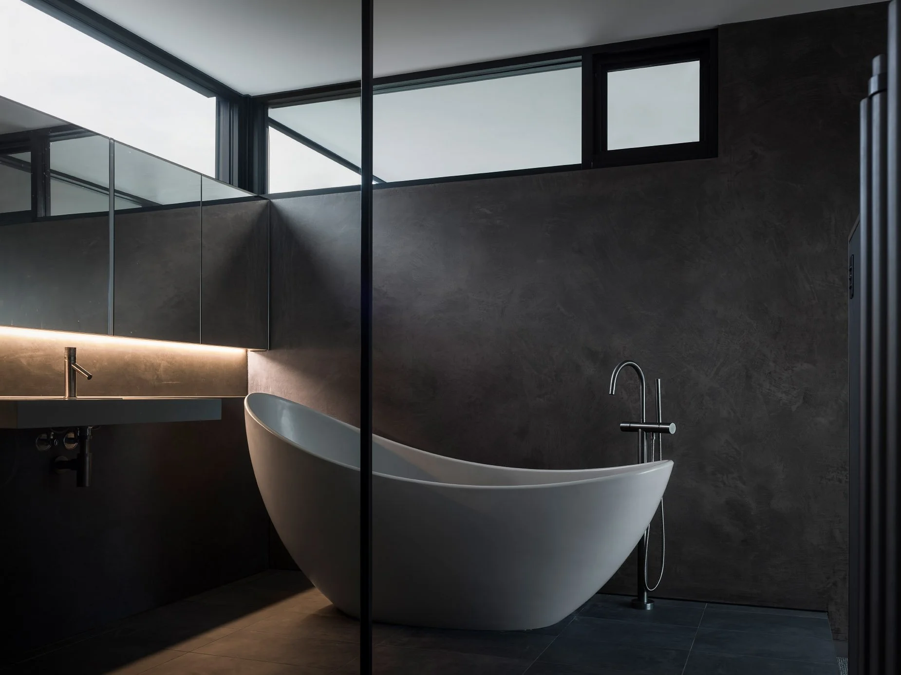 Master bathroom central coast with polished plaster, stone bath