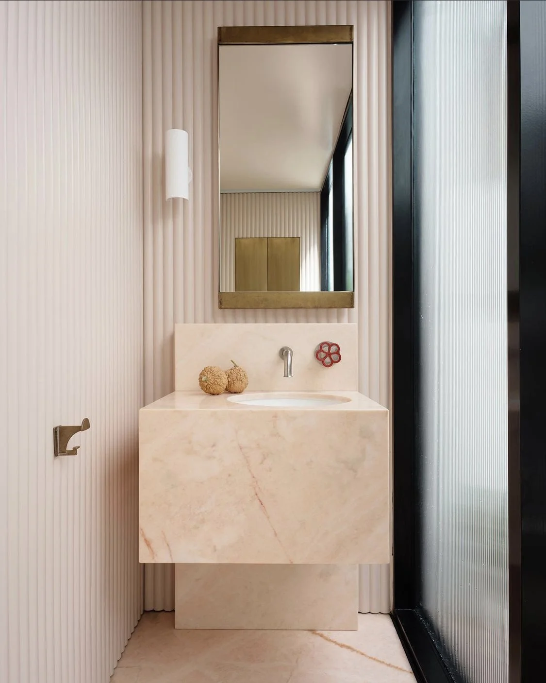 architectural design powder room, marble vanity, fluted glass, fluted walls