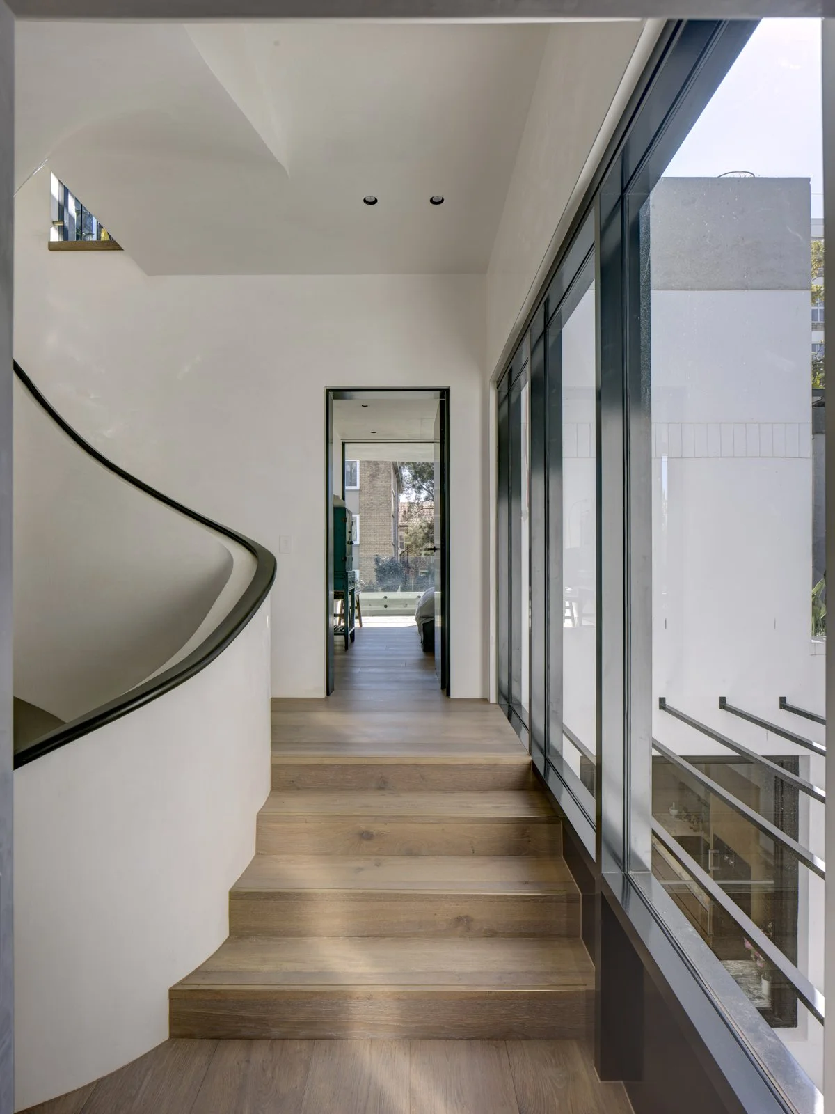 Luxury home staircase timber floors and glass windows Sydney NSW Arte Constructions