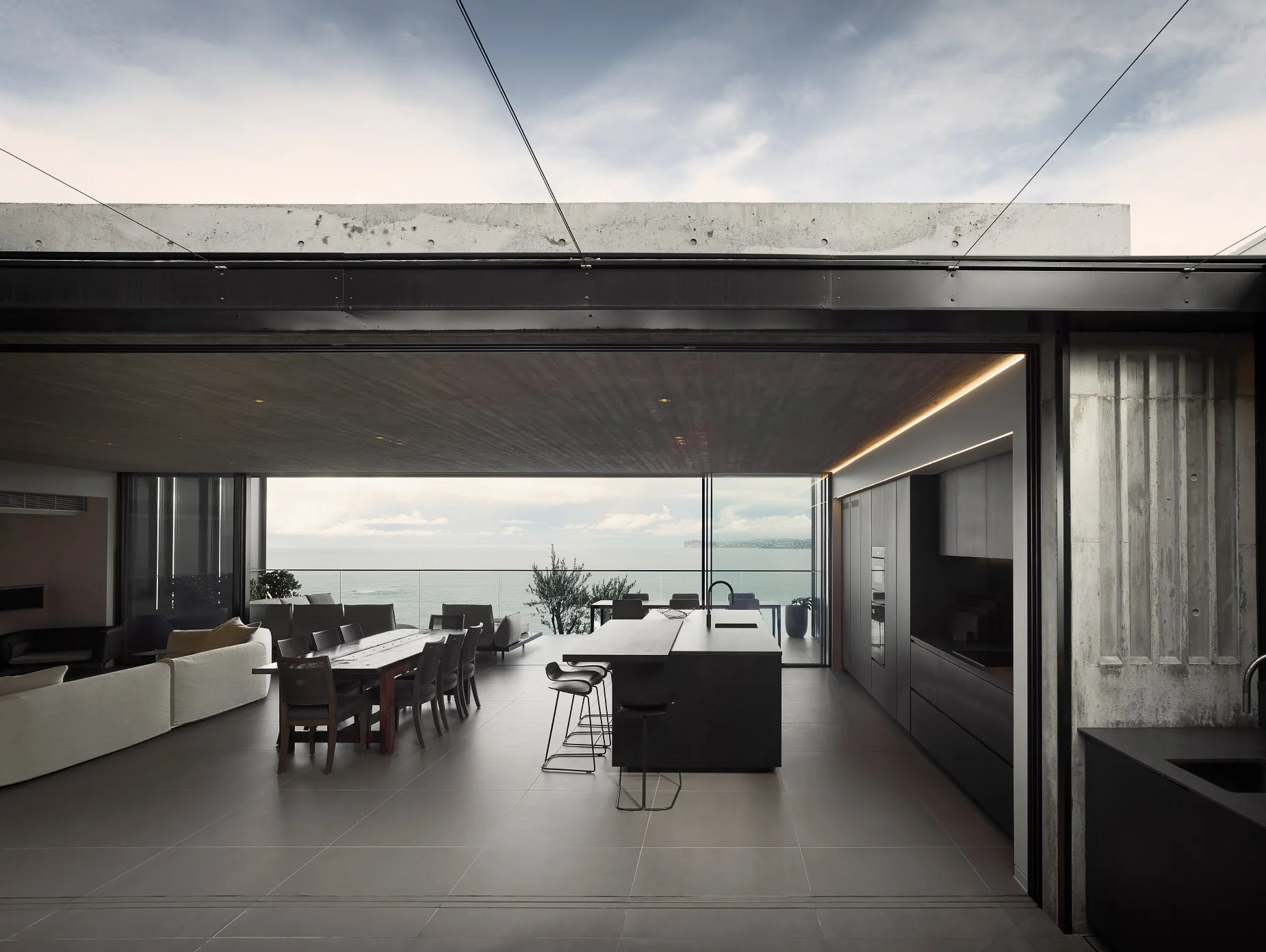 Off form concrete, ceilings, walls, views, vitrocsa doors black kitchen