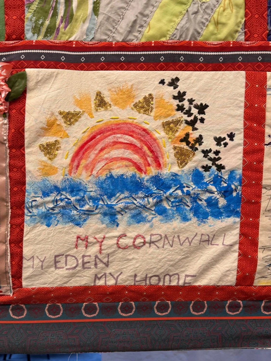 A fabric panel depicts the sun rising in Story Shelter by Bec Applebee. 