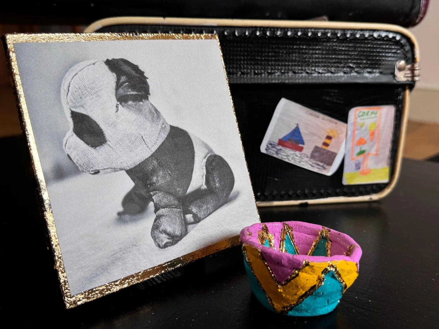 A picture of a panda toy beside a cermamic pot from an artwork called 'This is Me'.