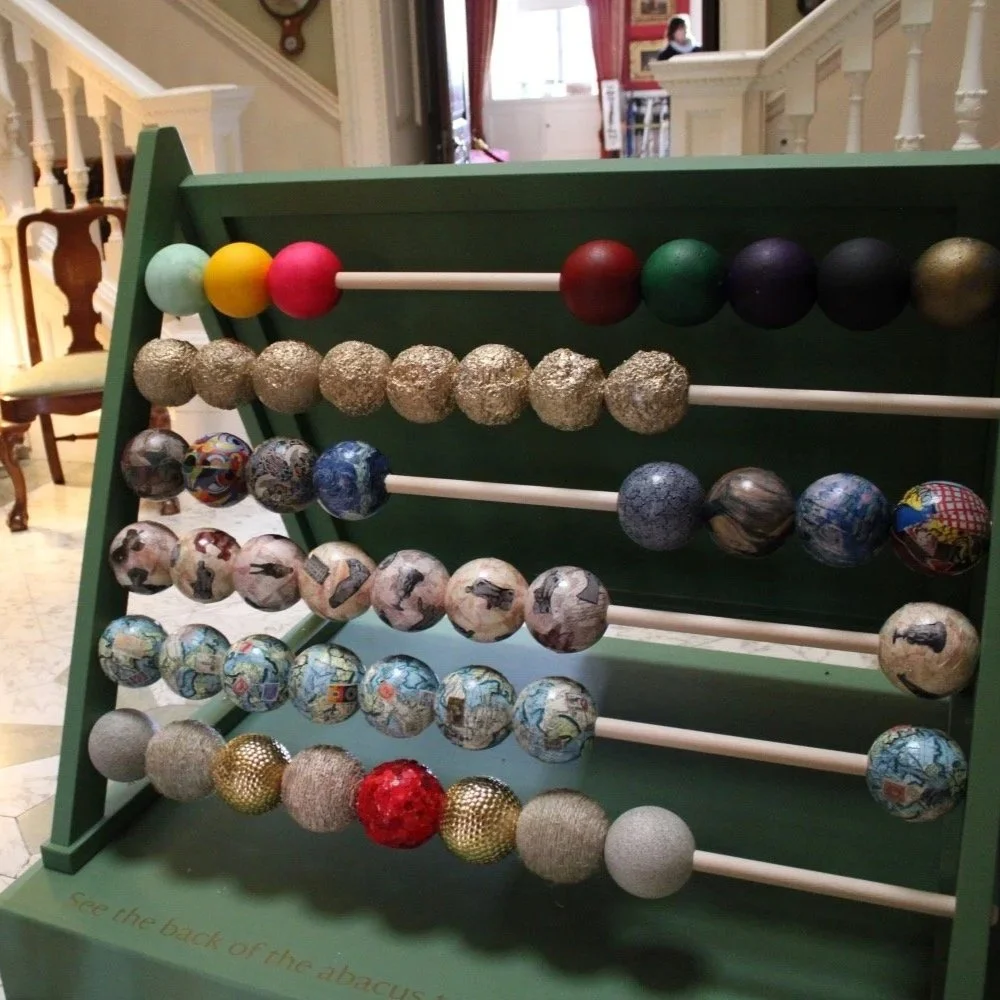 A giant abacus with brightly coloured balls.