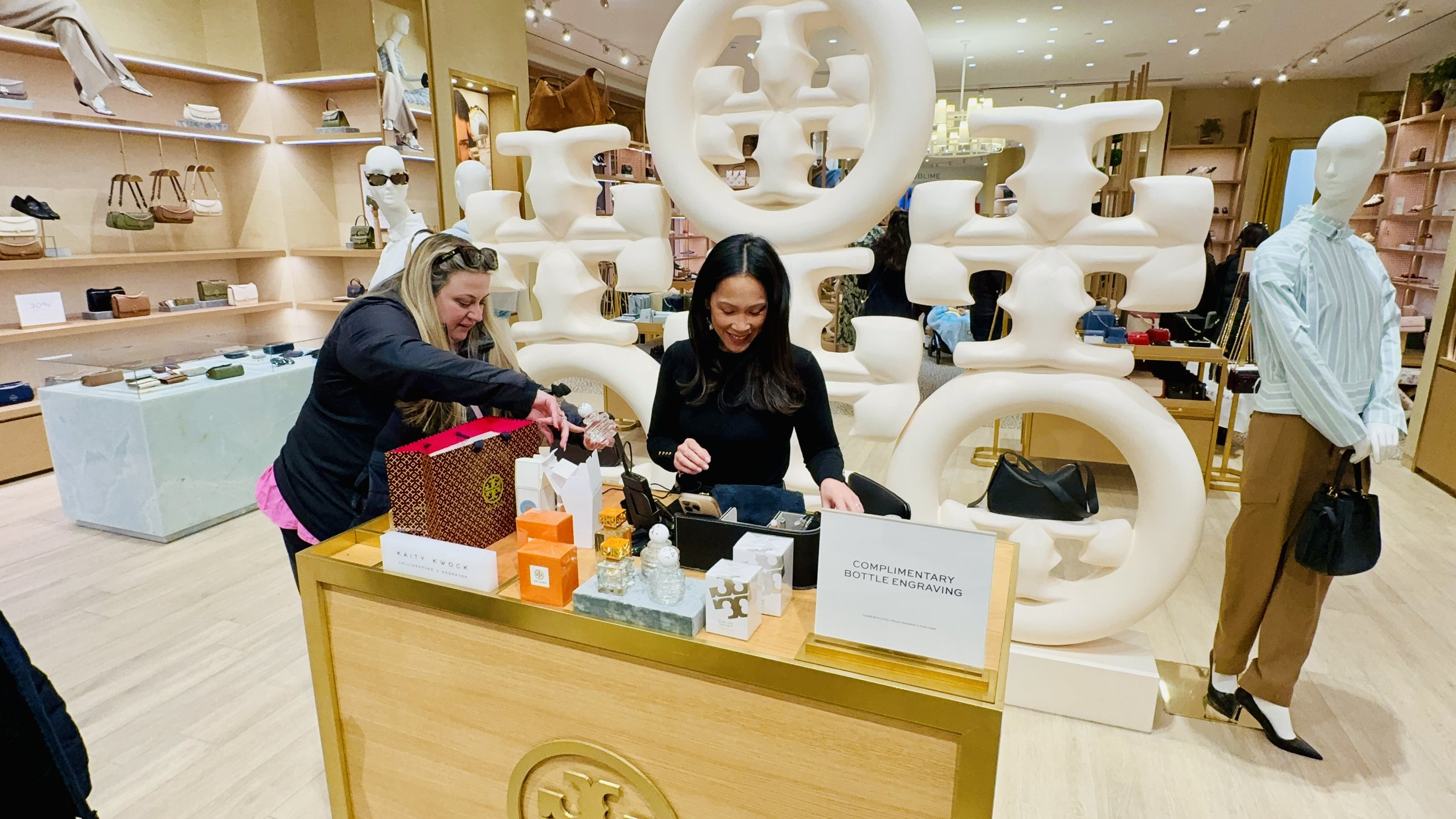 Live engraving and personalization brand activation at Tory Burch New York — KWK Creative Studio luxury retail brand activation artist serving NYC and New Jersey