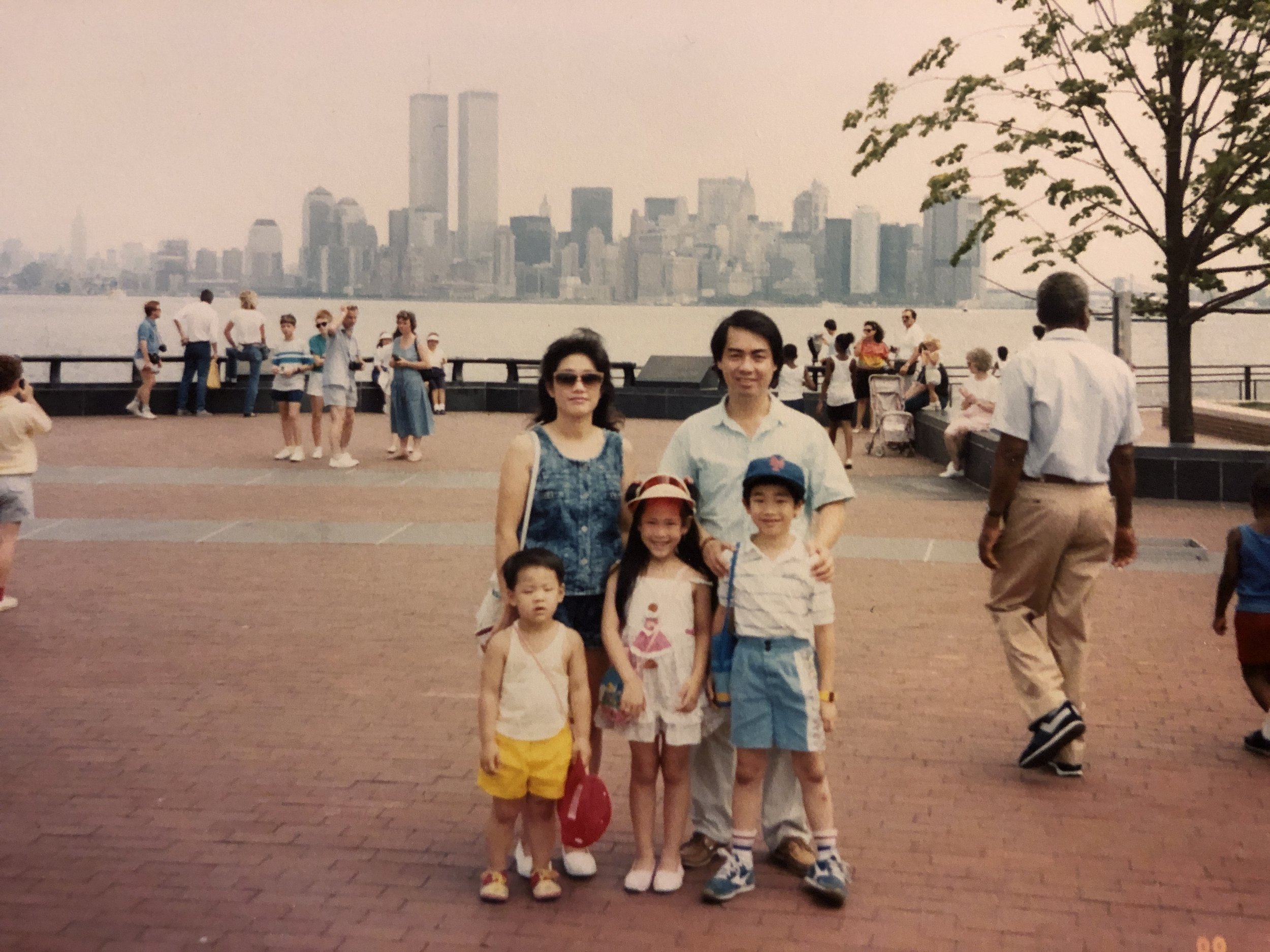 Kaity Kwock, Childhood photo of family across the water from downtown New York City. Kaity, New Jersey-based calligrapher and engraver, is the young girl in the photo.