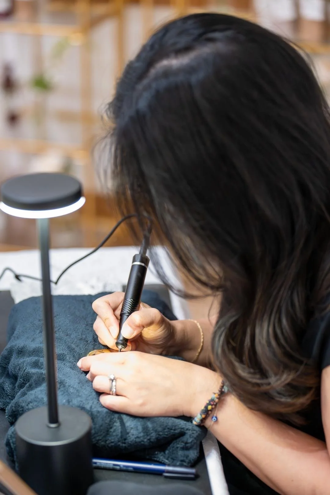 Live calligrapher creating personalized guest details during a luxury event activation in New York City