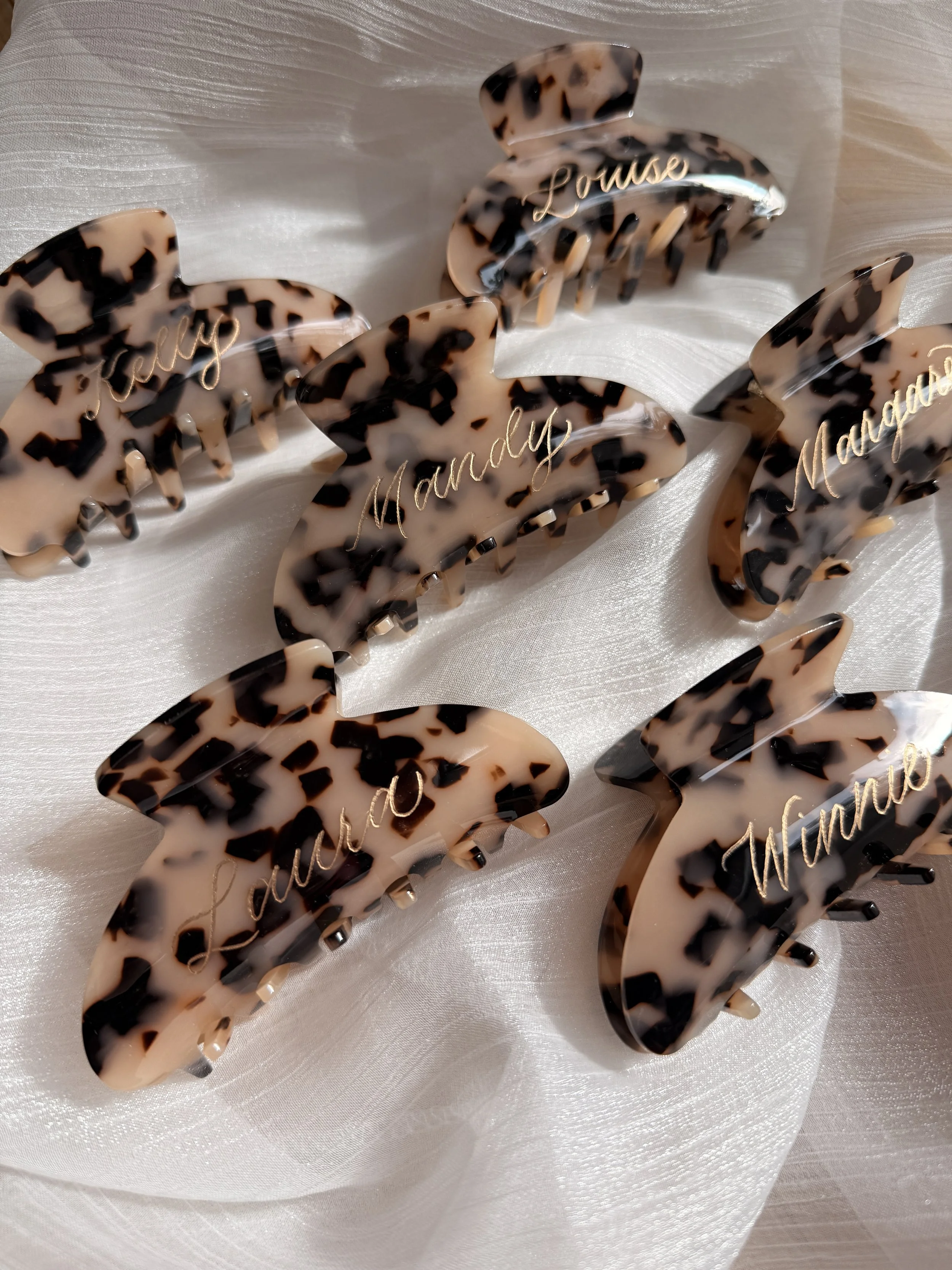 Personalized tortoise shell hair claw clips with hand lettered gold engraving