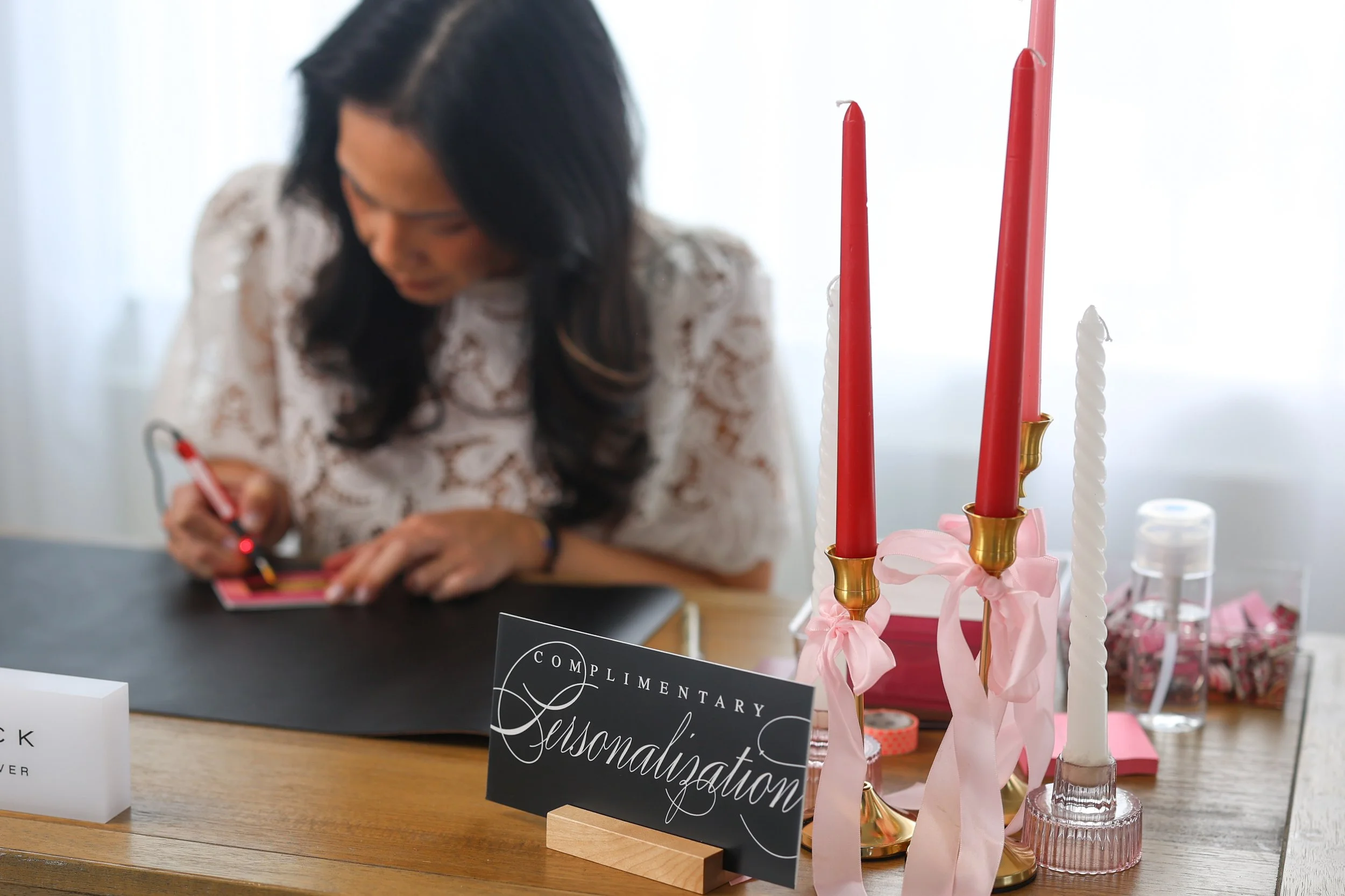 Kaity Kwock of KWK Creative Studio providing live hot foiling calligraphy personalization at a luxury influencer event in New York and New Jersey — live calligraphy, hot foiling and engraving for brand activations in NYC and New Jersey